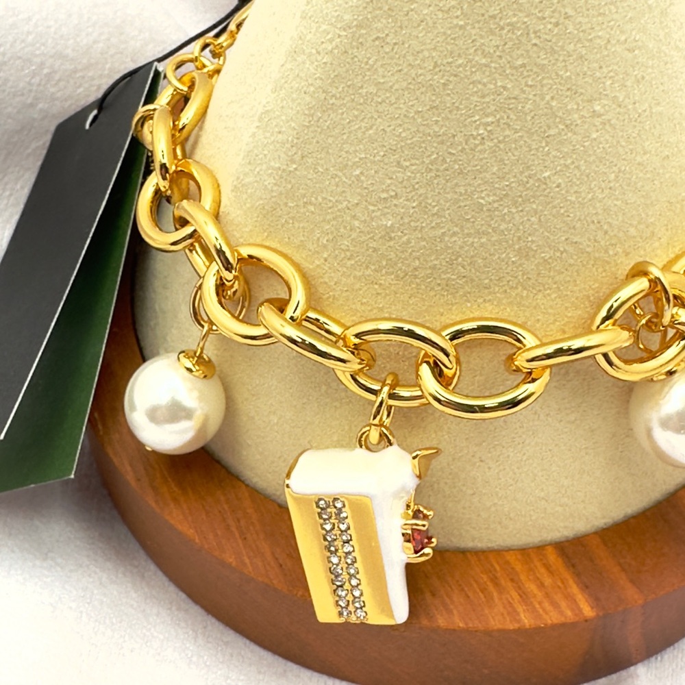 Kate Spade Gold Bracelet with Pearl and Cake Charm